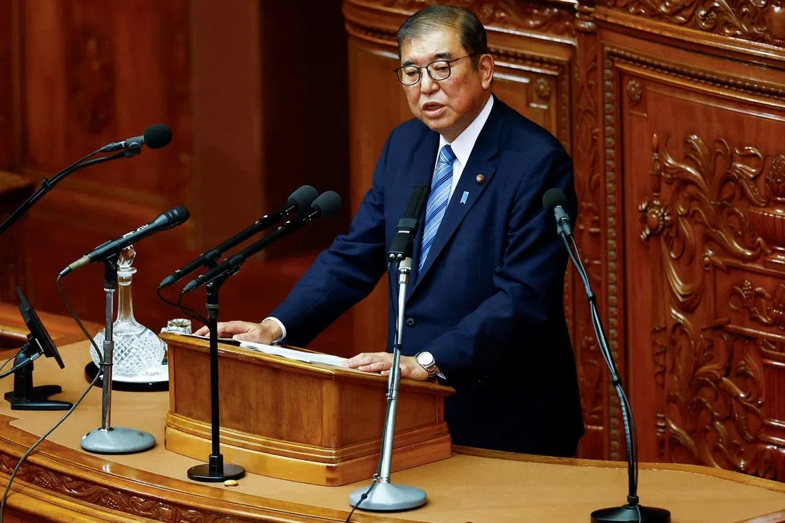 FILE PHOTO: Japan's Prime Minister Shigeru Ishiba delivers his policy speech at the lower house of the parliament in Tokyo, Japan, November 29, 2024.  REUTERS/Issei Kato/File Photo