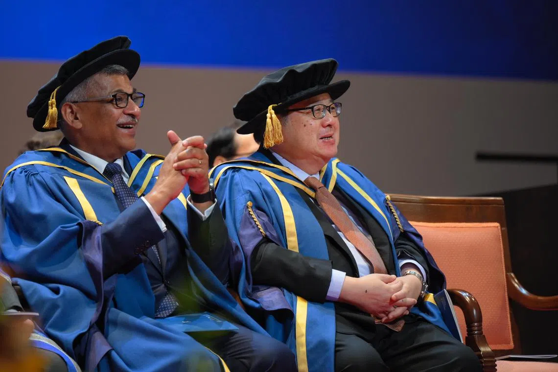 Chief Justice Sundaresh Menon (left), and Peter Ho (right), Senior Advisor to the Centre for Strategic Futures and Senior Fellow in the Civil Service College, watch as graduating students from the NUS Faculty of Science and NUS Lee Kuan Yew School of Public Policy receive their certificates during NUS commencement at the University Cultural Centre on July 11, 2024.