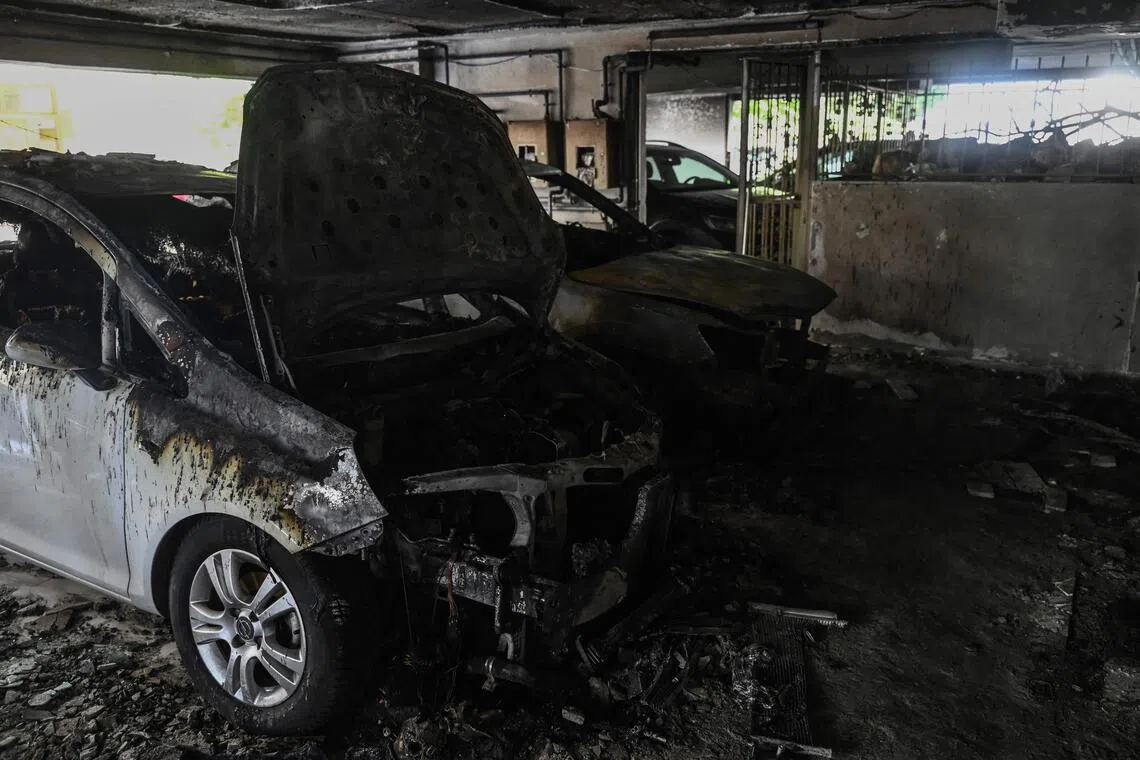 Damaged cars at a building in Thessaloniki, Greece, after a gas canister bomb exploded at the entrance on July 1.