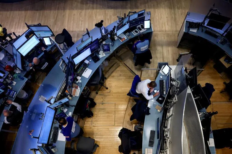 Traders work on the floor at the New York Stock Exchange in New York City, on March 9.