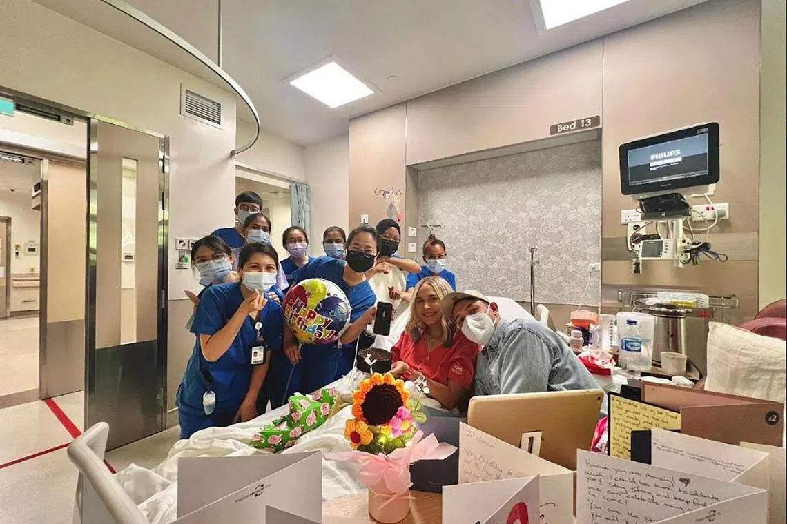 Mrs Hannah Thomas (second from right) received an infusion of CAR-T therapy cells in December 2023, just a day before her birthday, as part of the experimental treatment for T-cell acute lymphoblastic leukaemia.