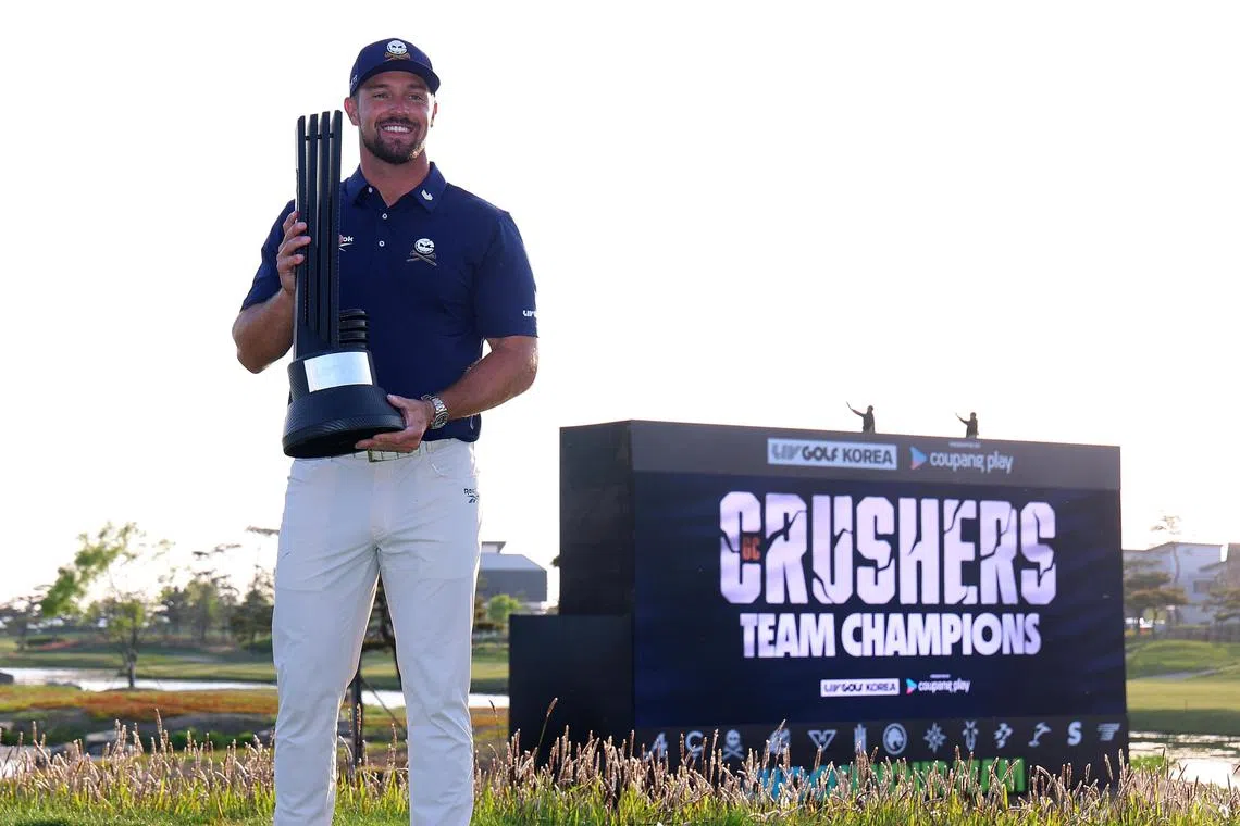 Bryson DeChambeau of the United States poses for a photo with the victor's trophy after winning LIV Golf Korea on May 4.
