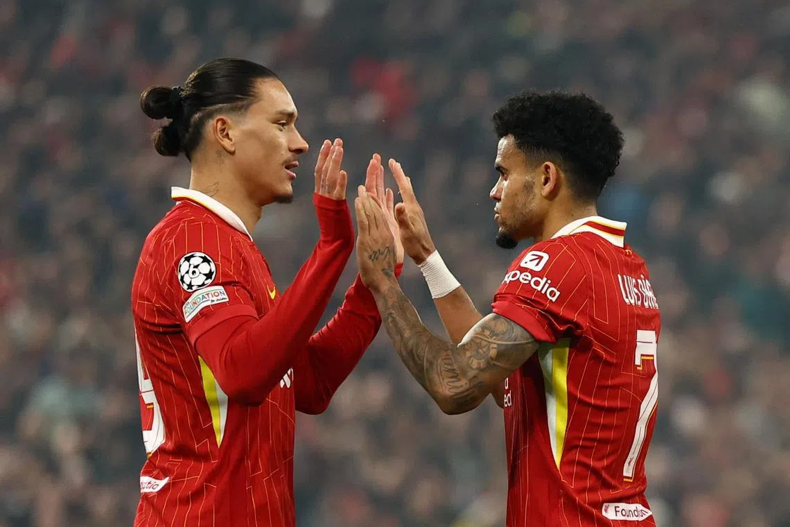 Liverpool's Luis Diaz celebrates scoring their third goal with teammate Darwin Nunez.