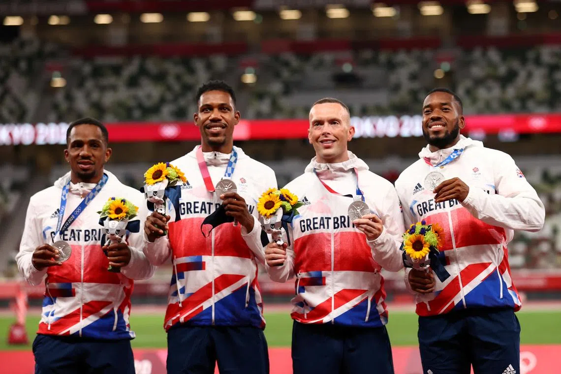 FILE PHOTO: Tokyo 2020 Olympics - Athletics - Men's 4 x 100m Relay - Medal Ceremony - Olympic Stadium, Tokyo, Japan - August 7, 2021. Silver medallists Chijindu Ujah of Britain, Zharnel Hughes of Britain, Richard Kilty of Britain and Nethaneel Mitchell-Blake of Britain pose on the podium REUTERS/Andrew Boyers/File Photo