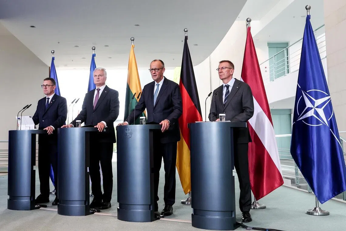 German Chancellor Friedrich Merz (third from left) giving a press briefing in Berlin on July 3, with (from left) Estonian Prime Minister Kristen Michal, Lithuanian President Gitanas Nauseda and Latvian President Edgars Rinkevics. PHOTO: EPA