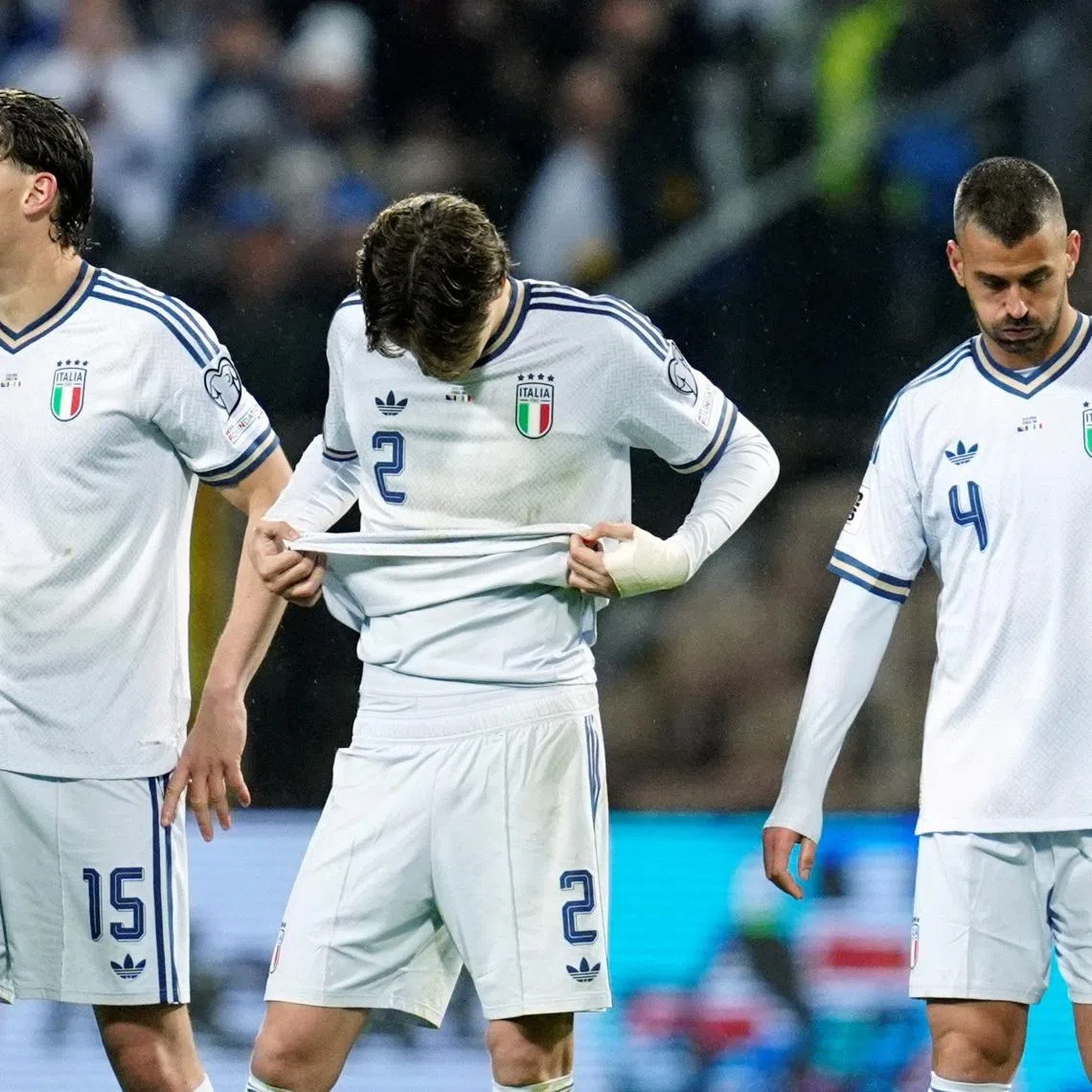 Soccer Football - FIFA World Cup - UEFA Qualifiers - Finals - Bosnia and Herzegovina v Italy - Bilino Polje Stadium, Zenica, Bosnia and Herzegovina - March 31, 2026 Italy's Pio Esposito, Marco Palestra and Leonardo Spinazzola look dejected after the match after failing to qualify for the FIFA World Cup REUTERS/Matteo Ciambelli