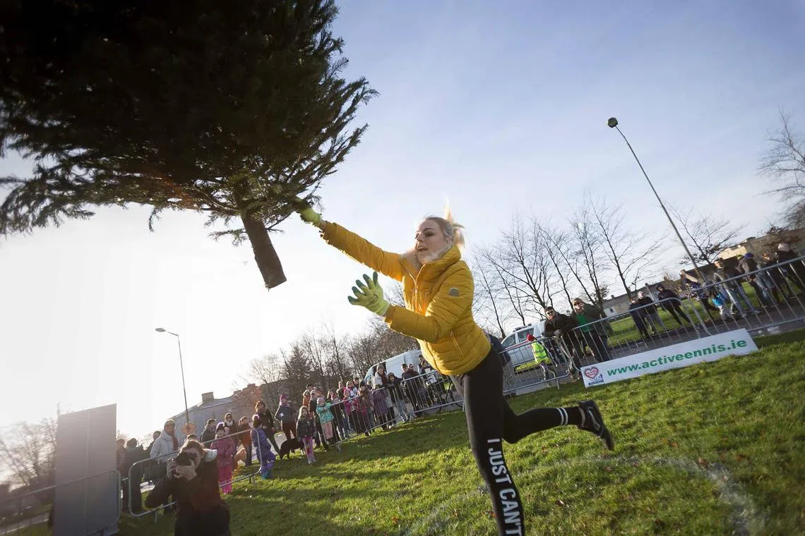 Kamila Grabska throwing a tree during the annual Christmas Tree throwing Championships in Ennis, County Clare, Ireland on Jan 8, 2018. 