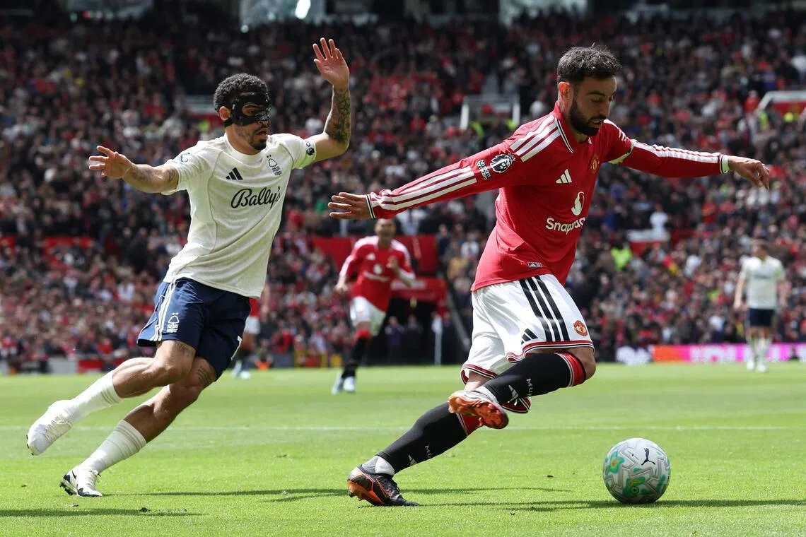 Manchester United's Portuguese midfielder #08 Bruno Fernandes (R) vies with Nottingham Forest's English midfielder #10 Morgan Gibbs-White (L) during the English Premier League football match between Manchester United and Nottingham Forest at Old Trafford in Manchester, north west England, on May 17, 2026. (Photo by Darren Staples / AFP) / RESTRICTED TO EDITORIAL USE. No use with unauthorized audio, video, data, fixture lists, club/league logos or 'live' services. Online in-match use limited to 120 images. An additional 40 images may be used in extra time. No video emulation. Social media in-match use limited to 120 images. An additional 40 images may be used in extra time. No use in betting publications, games or single club/league/player publications. / 