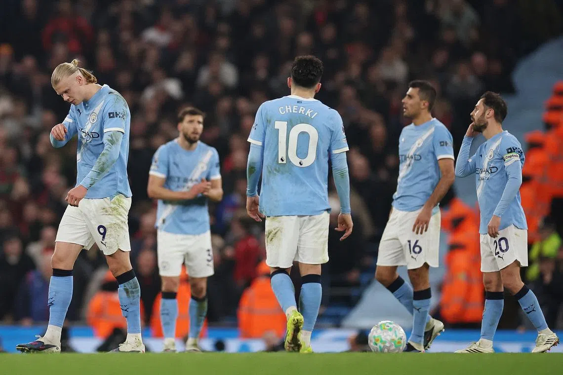 Soccer Football - Premier League - Manchester City v Nottingham Forest - Etihad Stadium, Manchester, Britain - March 4, 2026 Manchester City players look dejected after Nottingham Forest's Elliot Anderson scores their second goal REUTERS/Phil Noble