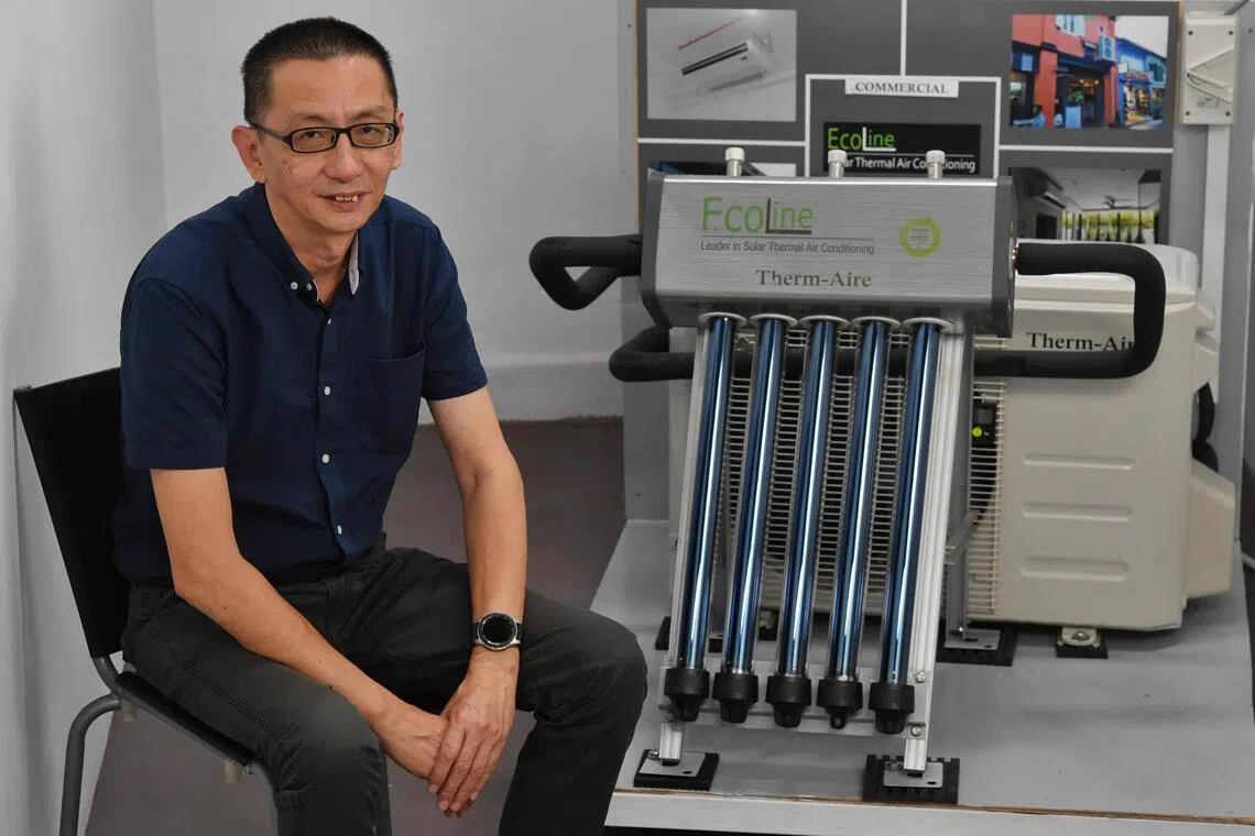 Mr Colin Chia, co-founder of Ecoline Solar, with the solar thermal air-conditioning system manufactured by his firm. Mr Chia, a Singaporean inventor and entrepreneur, first brought his invention onto the market in 2006, most people were still unaware of global warming or unconcerned.