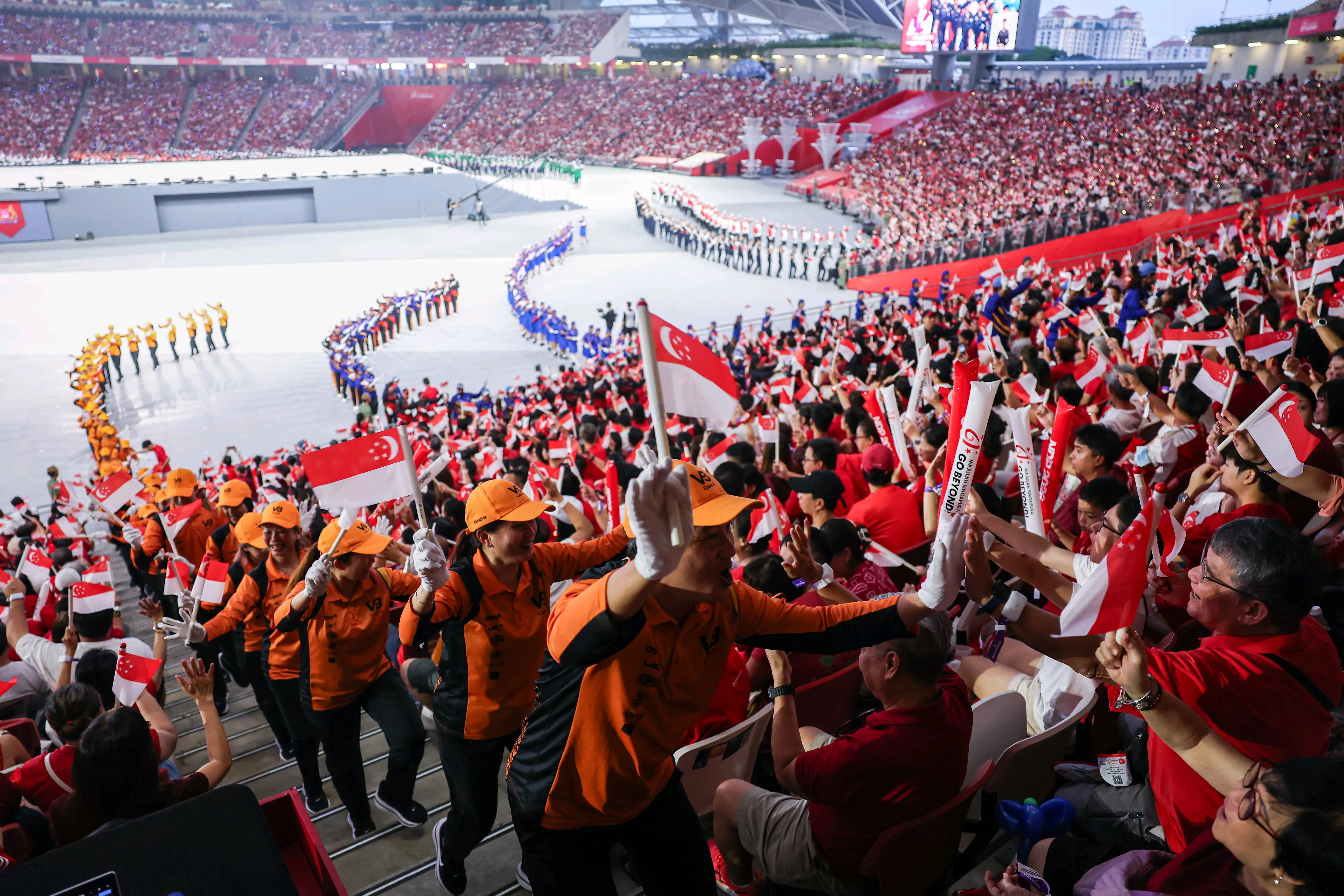 Parade contingents marching off during National Day Parade 2026 at the National Stadium on Aug 9, 2026. ST PHOTO: BRIAN TEO