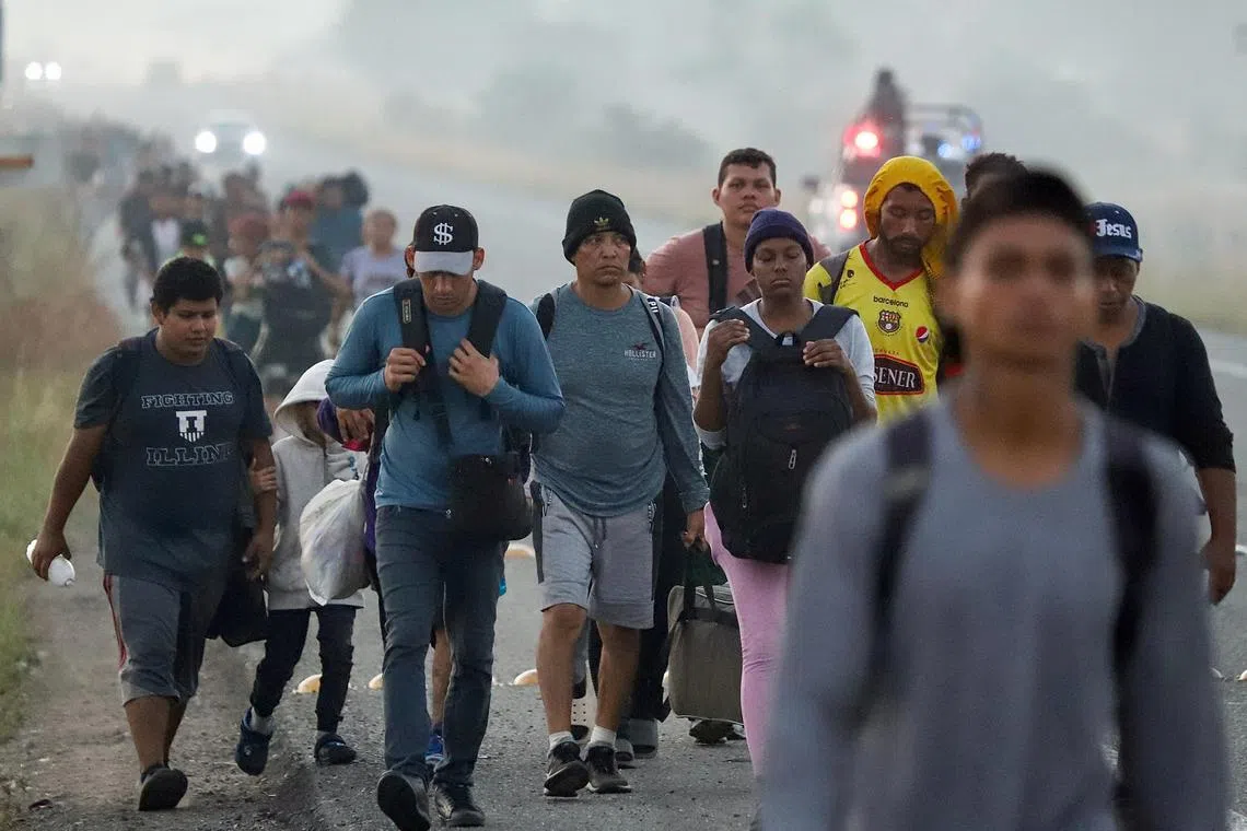 Migrants heading for the US border walk in a caravan, in Mexico's Oaxaca state.