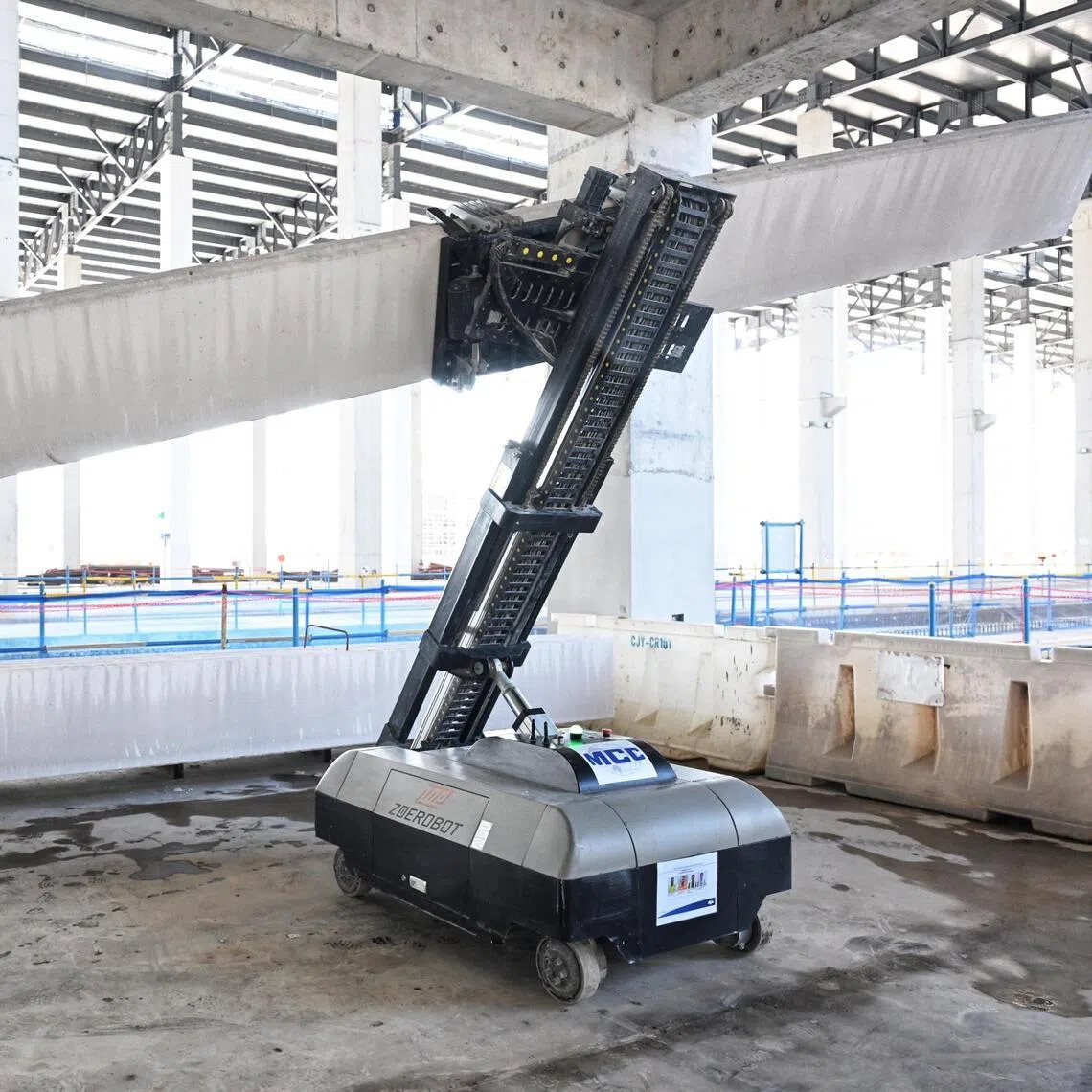 Demonstration of a Autoclaved Lightweight Concrete (ALC) wall panel installation robot seen at the Changi East Depot construction site on May 20.