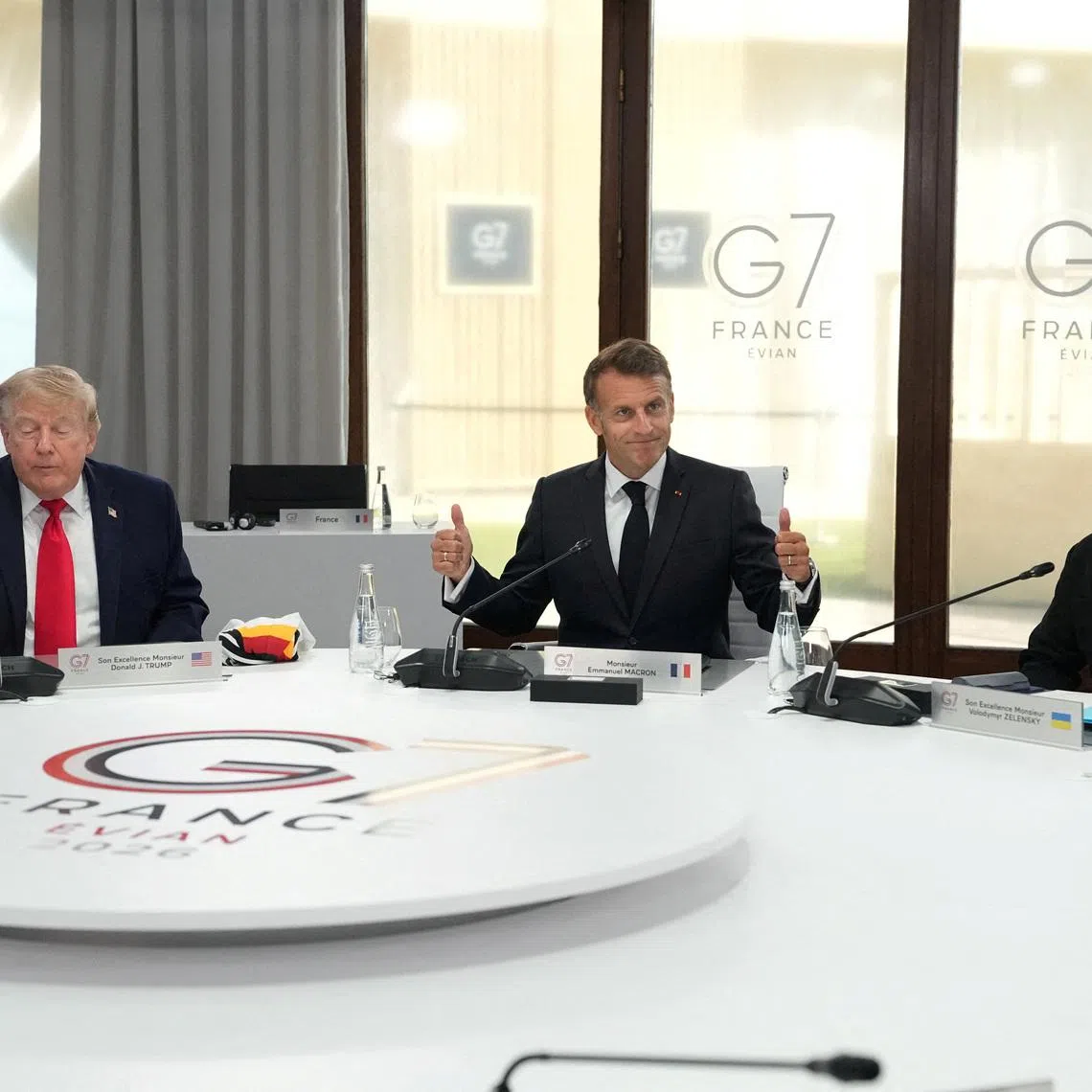 U.S. President Donald Trump, French President Emmanuel Macron and Ukrainian President Volodymyr Zelenskiy during a working session at the G7 summit in Evian-les-Bains, France, June 16, 2026.     Thibault Camus/Pool via REUTERS