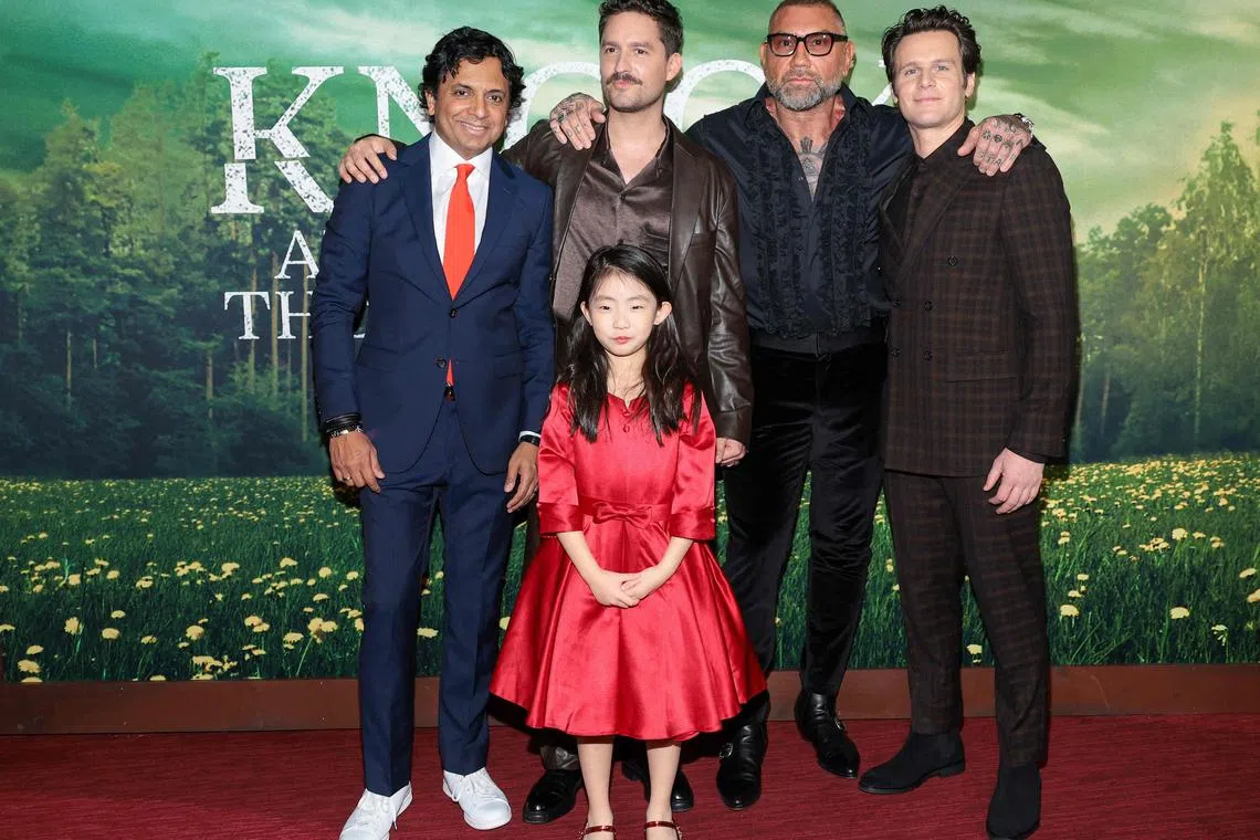 NEW YORK, NEW YORK - JANUARY 30: (L-R) M. Night Shyamalan, Kristen Cui, Ben Aldridge, Dave Bautista and Jonathan Groff attend Universal Pictures' "Knock At The Cabin" World Premiere at Jazz at Lincoln Center on January 30, 2023 in New York City.   Dimitrios Kambouris/Getty Images/AFP (Photo by Dimitrios Kambouris / GETTY IMAGES NORTH AMERICA / Getty Images via AFP)