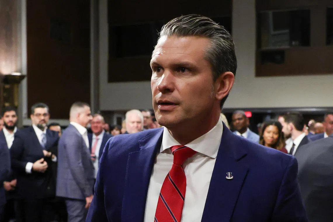 FILE PHOTO: Pete Hegseth, U.S. President-elect Donald Trump's nominee to be secretary of defense, leaves a Senate Committee on Armed Services confirmation hearing on Capitol Hill in Washington, U.S., January 14, 2025. REUTERS/Evelyn Hockstein/File Photo