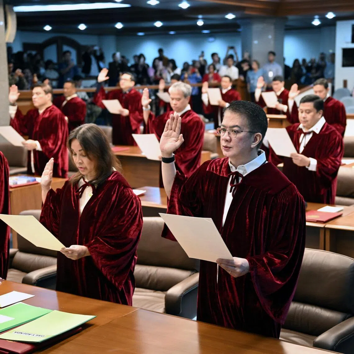 Philippine senators take their oath as jurors in the impeachment trial of Vice-President Sara Duterte.