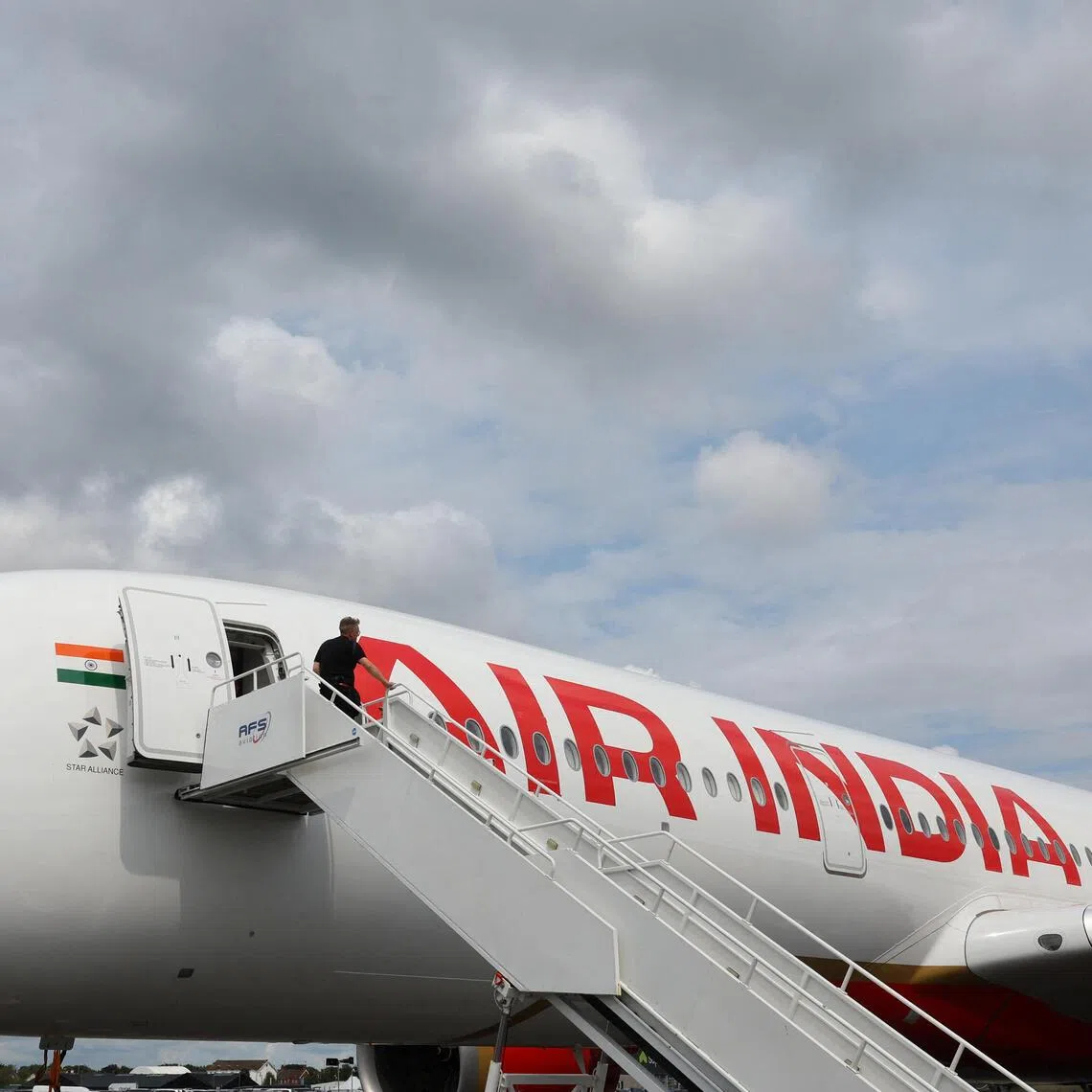 Tata-owned Air India was battered by a record loss of 220 billion rupees (S$2.95 billion) in the year ended March 31.