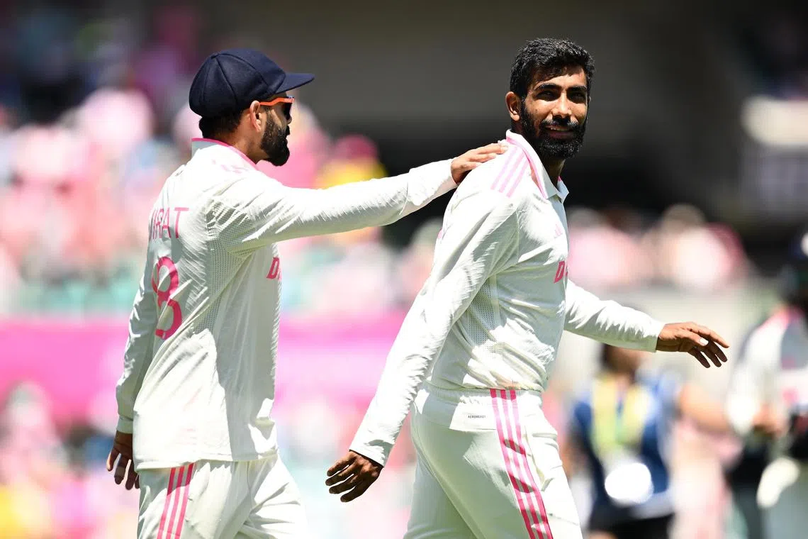 Virat Kohli (left) and Jasprit Bumrah of India react following the team's loss against Australia at the Sydney Cricket Ground.