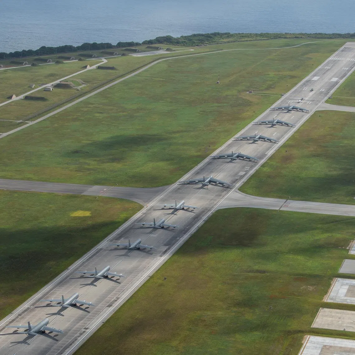 A U.S. Navy MH-60S Knighthawk, U.S. Air Force RQ-4 Global Hawk, Navy MQ-4C Triton, Air Force B-52 Stratofortresses, and KC-135 Stratotankers perform an \"Elephant Walk\" at Andersen Air Force Base, Guam April 13, 2020. Picture taken April 13, 2020. U.S. Air Force/Senior Airman Michael S. Murphy/Handout via REUTERS/File Photo