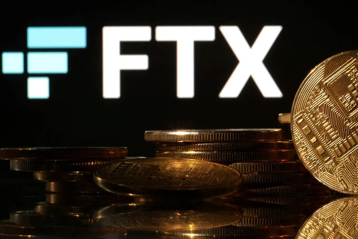 FILE PHOTO: Representations of cryptocurrencies are seen in front of displayed FTX logo in this illustration taken November 10, 2022. REUTERS/Dado Ruvic/Illustration/File Photo