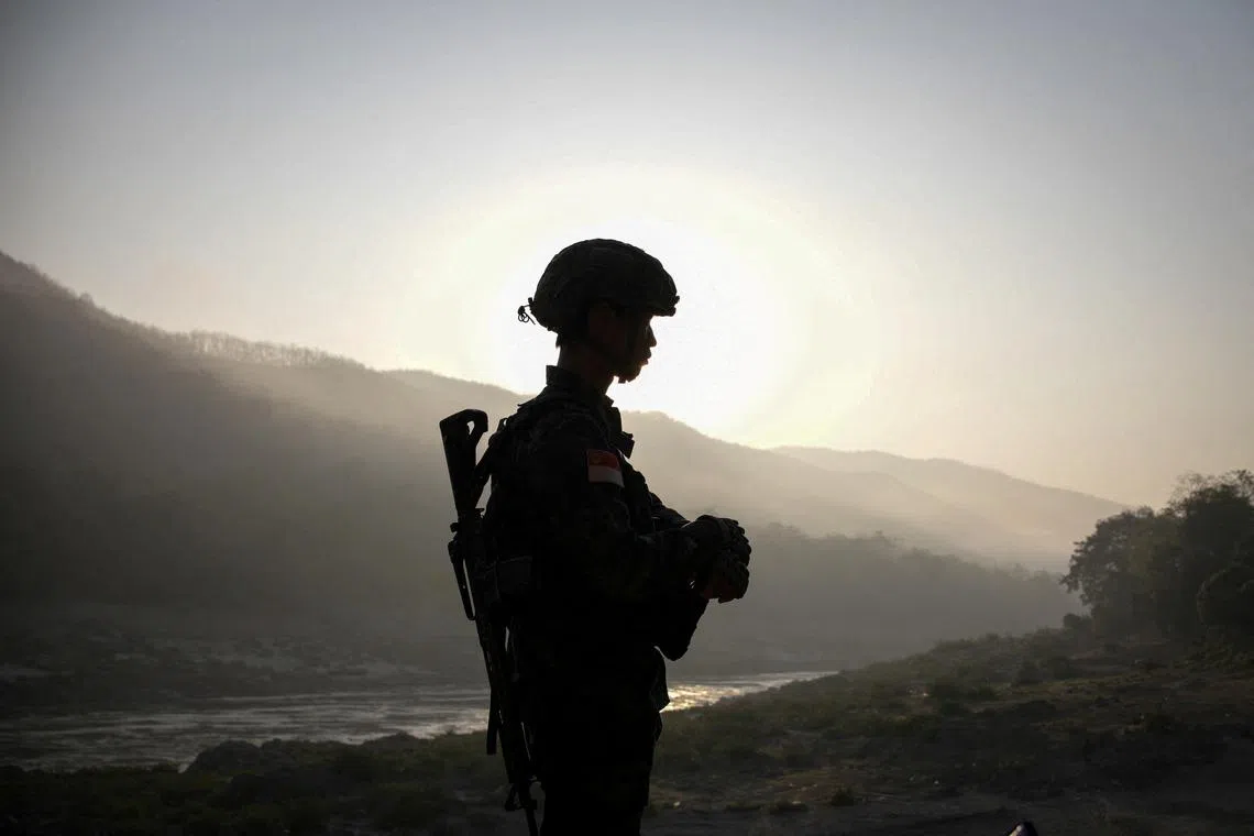 FILE PHOTO: A member of Bamar People's Liberation Army (BPLA) stands guard in territory belonging to the Karen National Liberation Army (KNLA), in Karen State, Myanmar, February 18, 2024. REUTERS/Stringer/File Photo