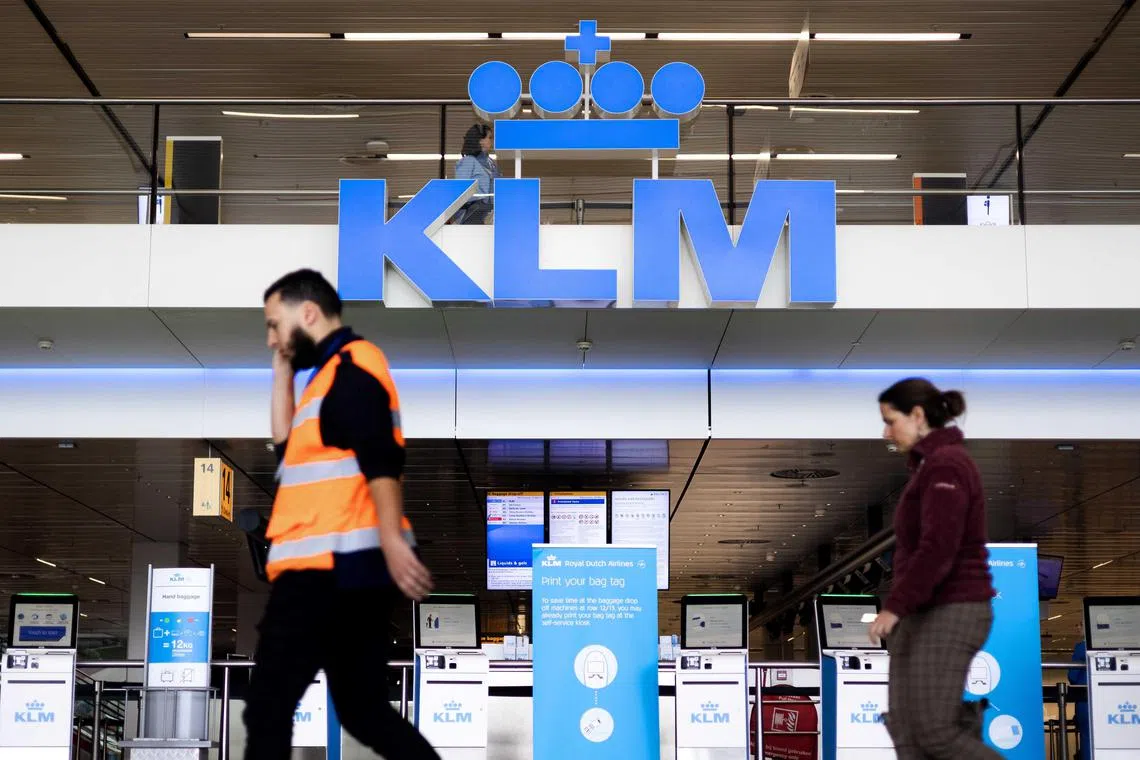 epa11232429 People pass KLM counters at Schiphol Airport in Amsterdam, The Netherlands, 20 March 2024. A court in Amsterdam has ruled on 20 March, that a number of advertising statements made by KLM in the past were misleading and therefore illegal. The ruling is the result of a lawsuit filed against KLM by the Fossielvrij Foundation, which alleges that KLM has engaged in greenwashing.  EPA-EFE/RAMON VAN FLYMEN