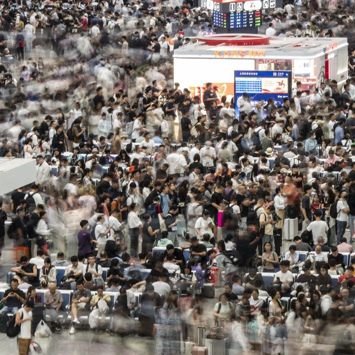 Travelers at Hongqiao Highspeed Railway Station ahead of the Golden Week holiday in Shanghai, China, on Tuesday, Sept. 30, 2025. Millions are expected to travel, shop and dine during China's eight-day Golden Week holiday starting Wednesday, which usually boosts economic activity across the country. Photographer: Qilai Shen/Bloomberg