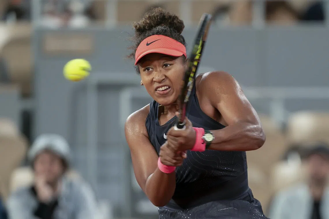 FILE PHOTO: May 29, 2024; Paris, France; Naomi Osaka of Japan returns a shot during her match against Iga Świątek of Poland on day four of Roland Garros at Stade Roland Garros. Mandatory Credit: Susan Mullane-USA TODAY Sports