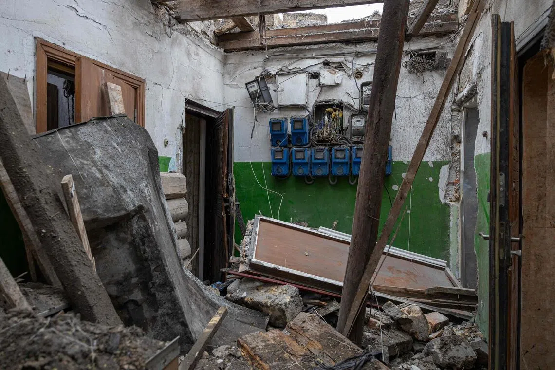 Debris in a hallway of a damaged residential building following a Russian overnight drone attack in Odesa on Feb 4, amid the Russian invasion of Ukraine.