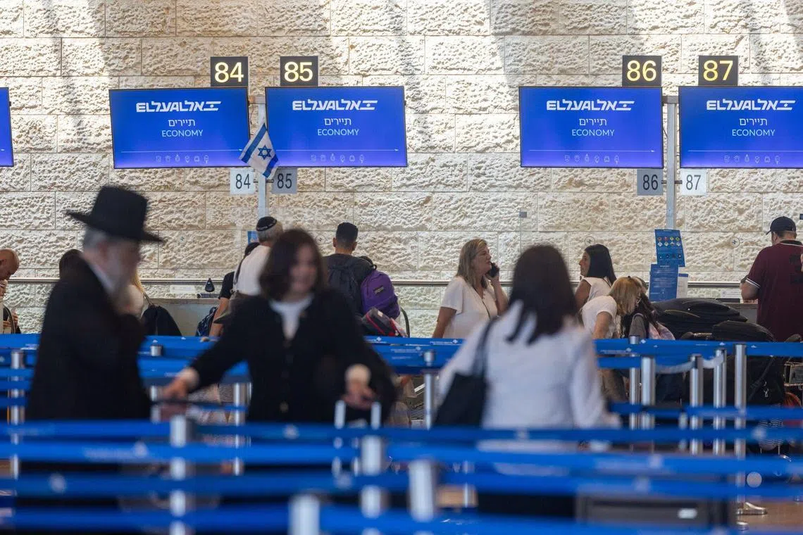Passengers in line for check-in at Ben Gurion International airport in Tel Aviv, Israel, on June 25 following a ceasefire that ended a 12-day conflict between Israel and Iran.