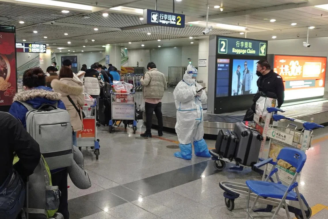 Travellers at the international airport in Chengdu, China, on Jan 6. China will open its borders on Sunday.
