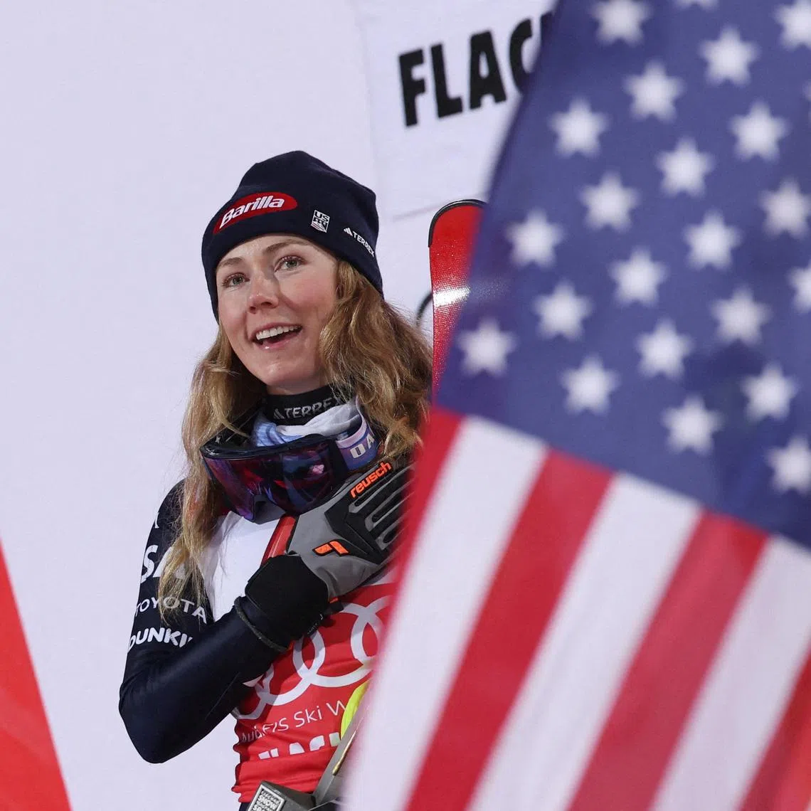Alpine Skiing - FIS Alpine Ski World Cup - Women's Night Slalom - Flachau, Austria - January 13, 2026 Mikaela Shiffrin of the U.S celebrates on podium after winning the Women's Slalom REUTERS/Gintare Karpaviciute