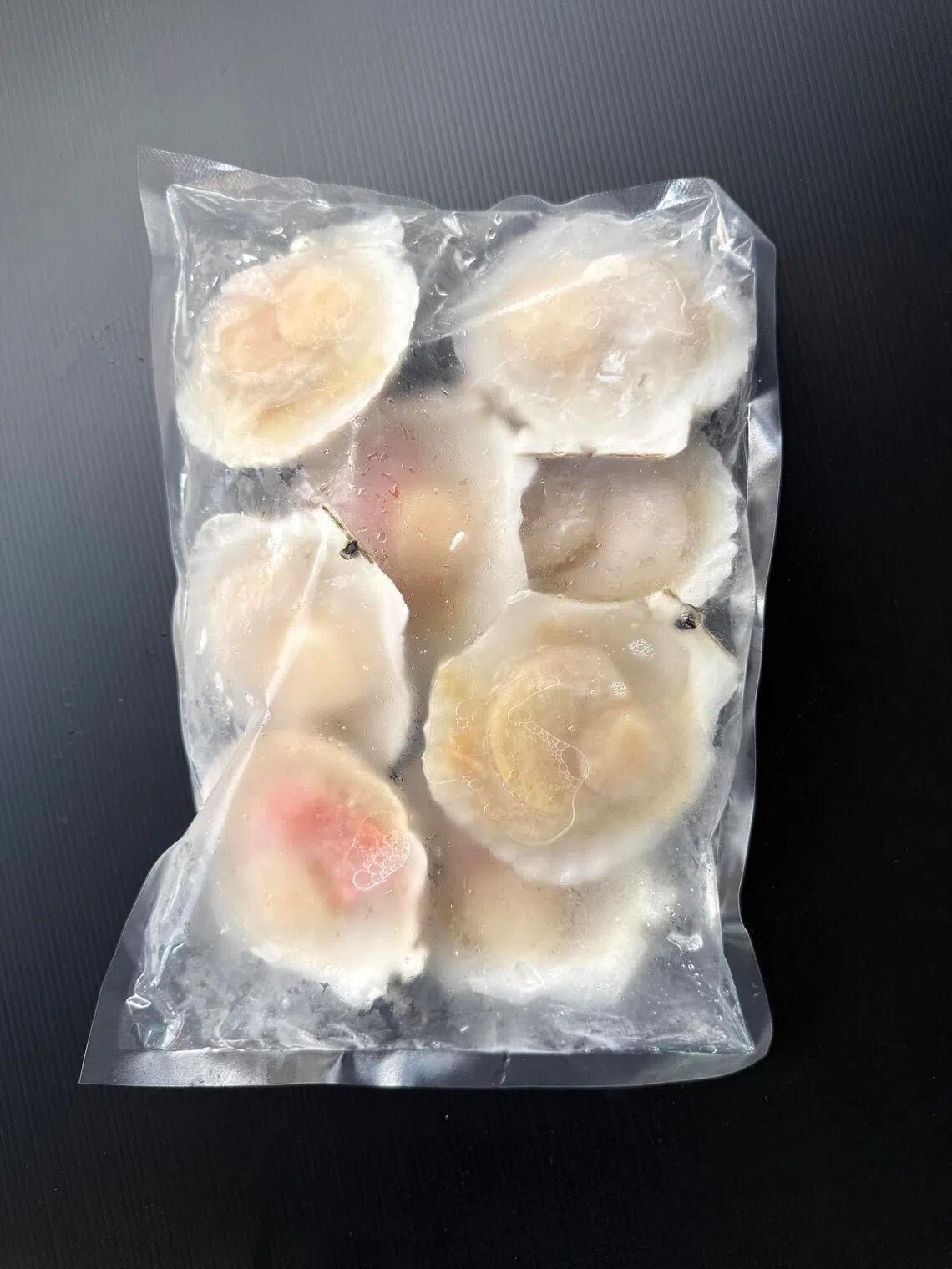 Vieiras em meia concha do The Seafood Market Place, de Song Fish.