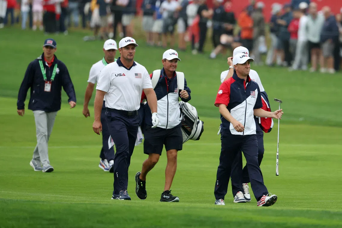 Golf - The 2025 Ryder Cup - Bethpage Black Golf Course, Farmingdale, New York, United States - September 25, 2025 Team USA's Bryson DeChambeau and Justin Thomas during a practice round REUTERS/Brendan Mcdermid