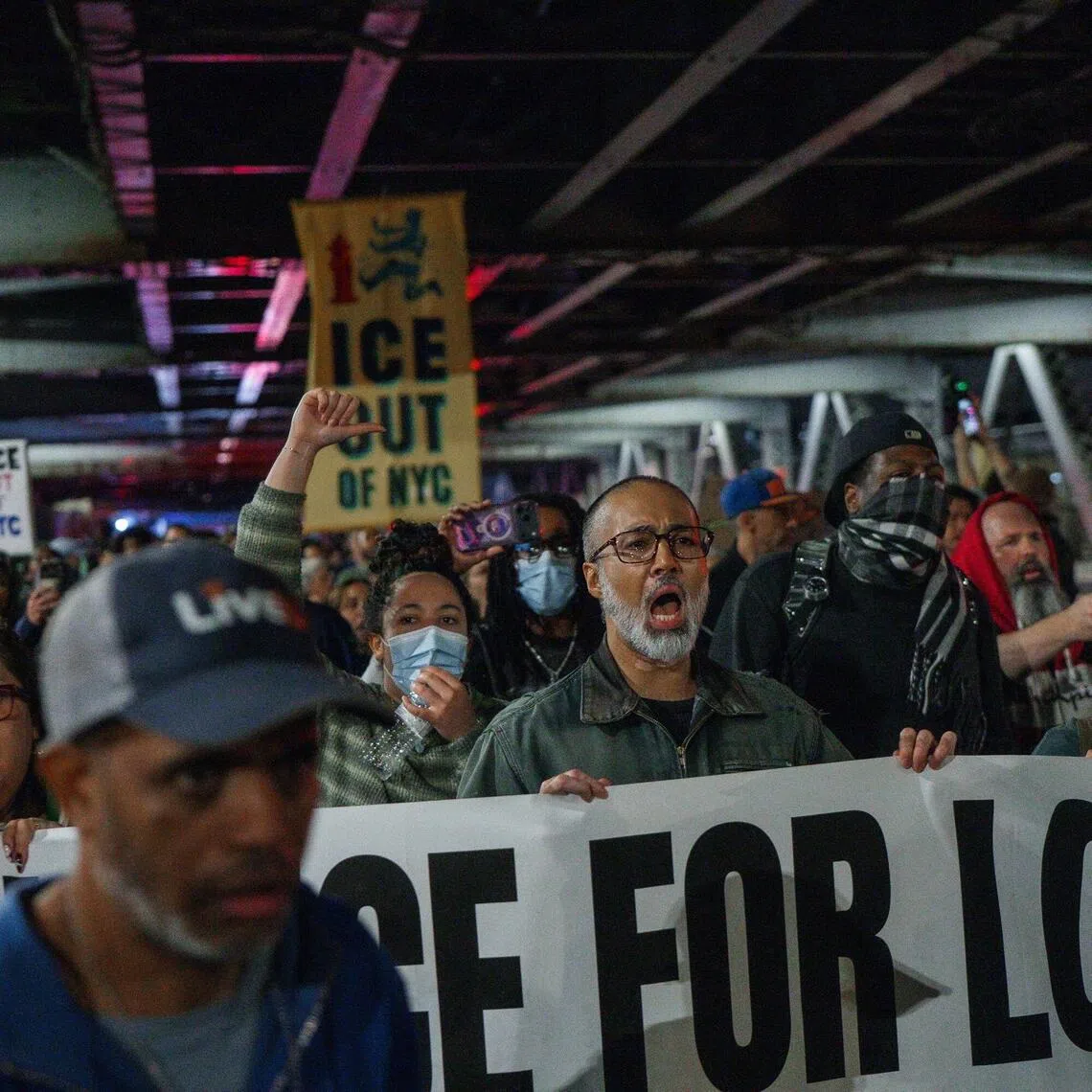 People march during a protest at the crime scene, after an ICE officer allegedly shot a man in New York, on Oct 8.