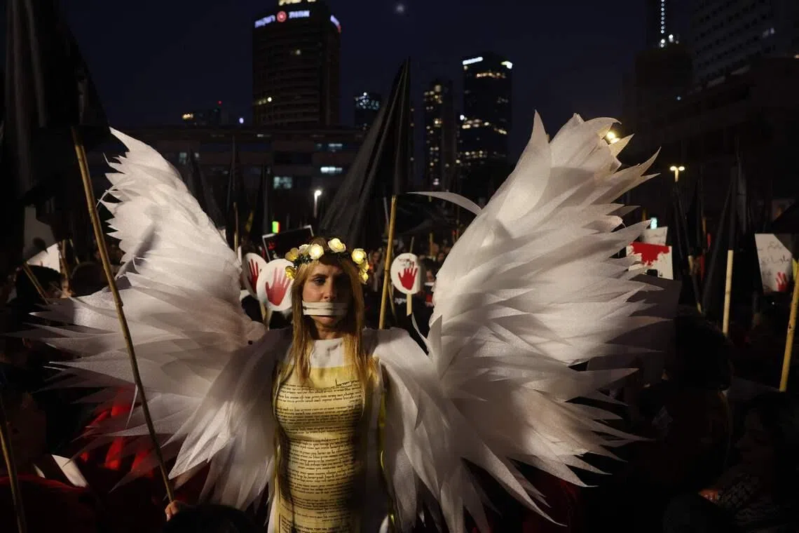 A woman wearing a costume stands during a demonstration by Arab-Israelis in Tel-Aviv, Israel on Jan 31, 2026, to draw attention to the rising crime rates in their community. 
