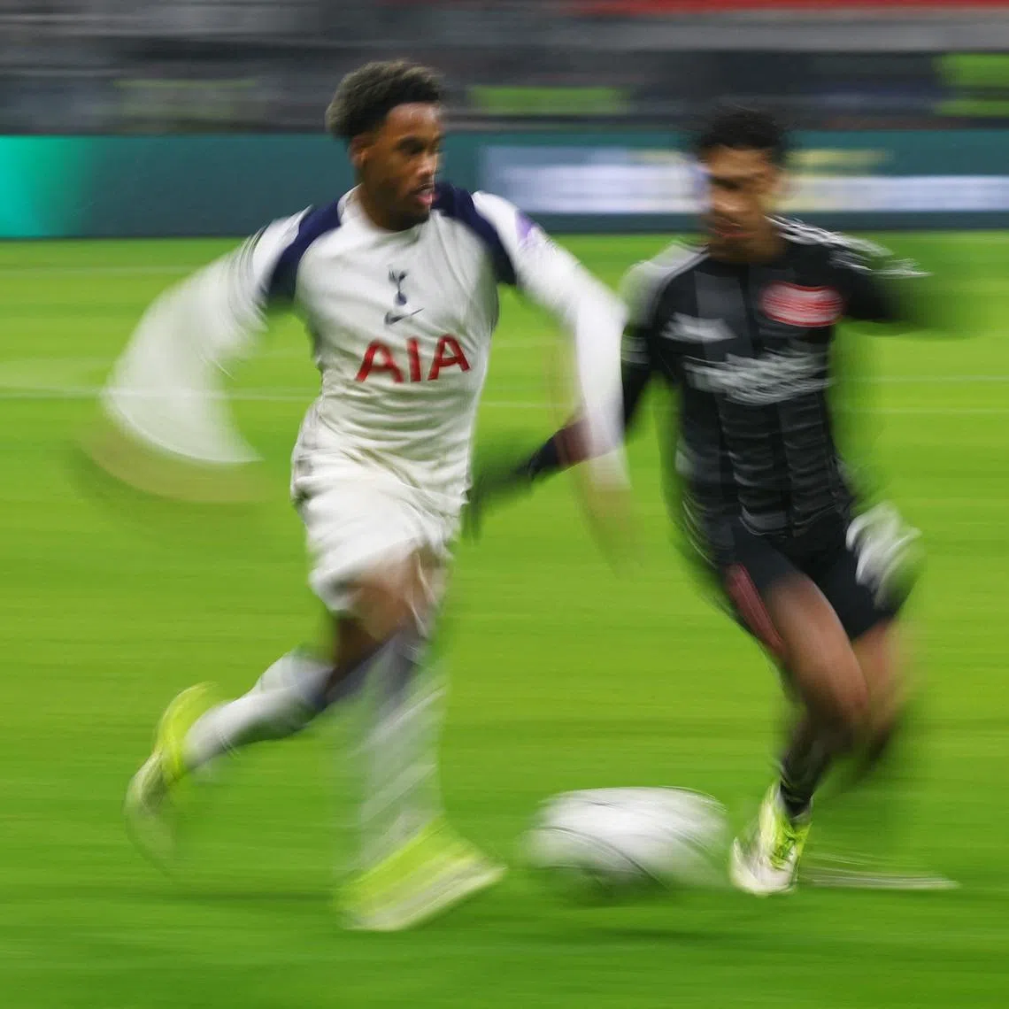 Soccer Football - UEFA Champions League - Eintracht Frankfurt v Tottenham Hotspur - Deutsche Bank Park, Frankfurt, Germany - January 28, 2026 Tottenham Hotspur's Wilson Odobert in action with Eintracht Frankfurt's Nathaniel Brown REUTERS/Kai Pfaffenbach