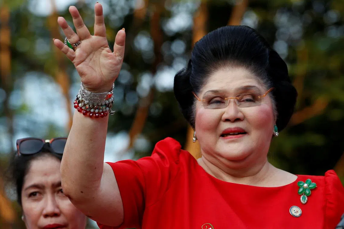 FILE PHOTO: Philippines Former First Lady and Congresswoman Imelda Marcos waves to supporters as she takes part in the announcement of her son BongBong Marcos' vice-presidential candidacy, in Manila Philippines October 10, 2015.  REUTERS/Erik De Castro/File Photo