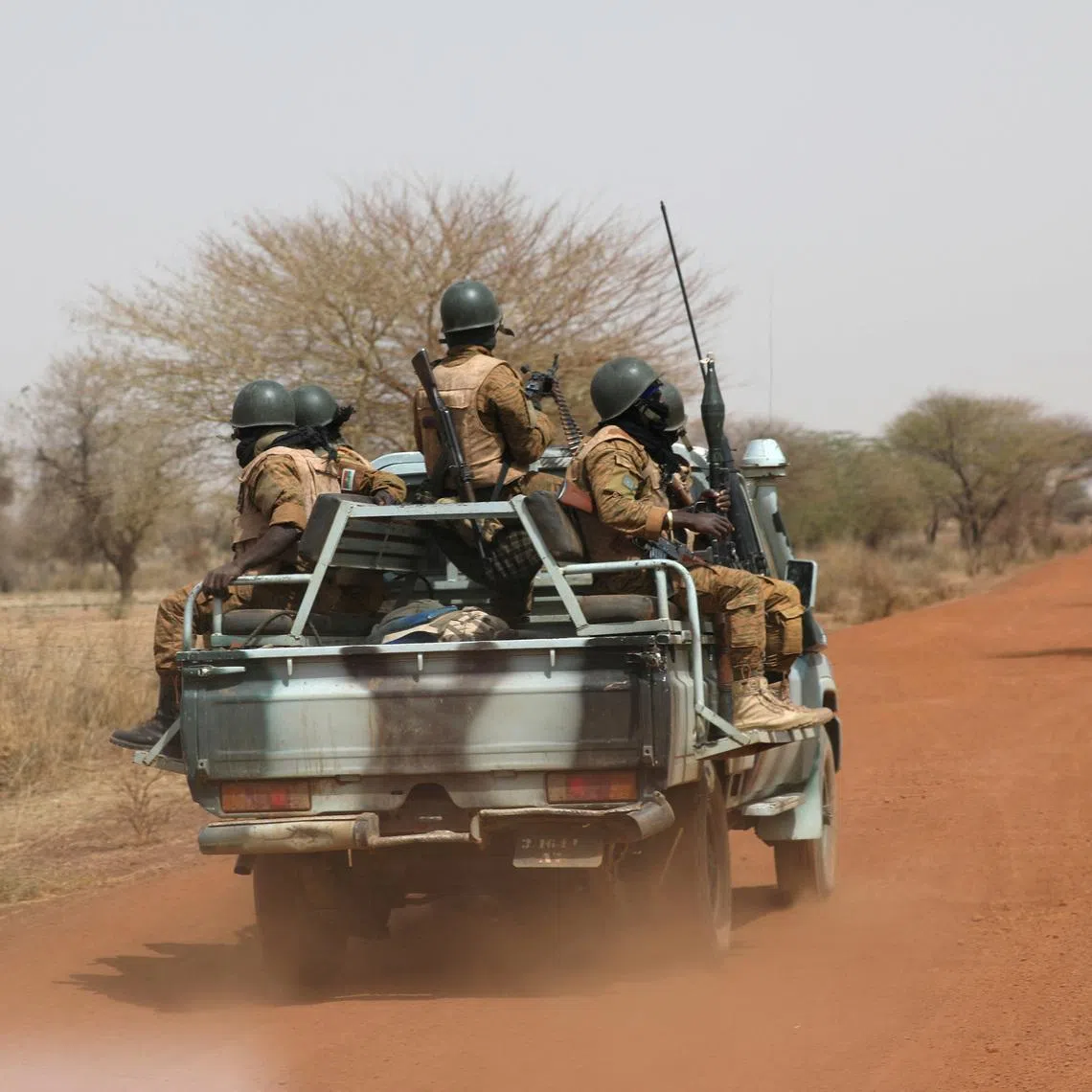 FILE PHOTO: Soldiers from Burkina Faso patrol on the road of Gorgadji in the Sahel region, Burkina Faso, March 3, 2019.   REUTERS/Luc Gnago/File Photo