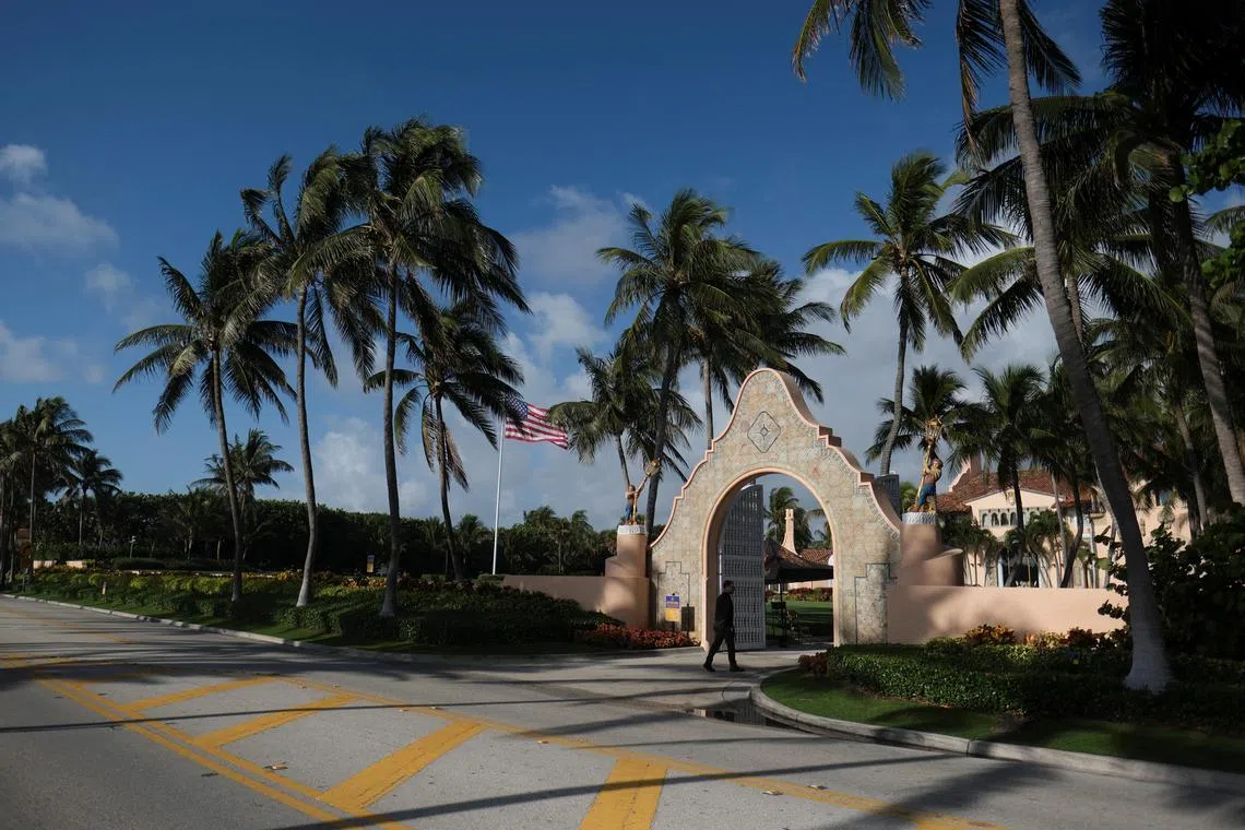 A security guard officer guards the entrance to the Mar-a-Lago home of former US President Donald Trump on April 1.