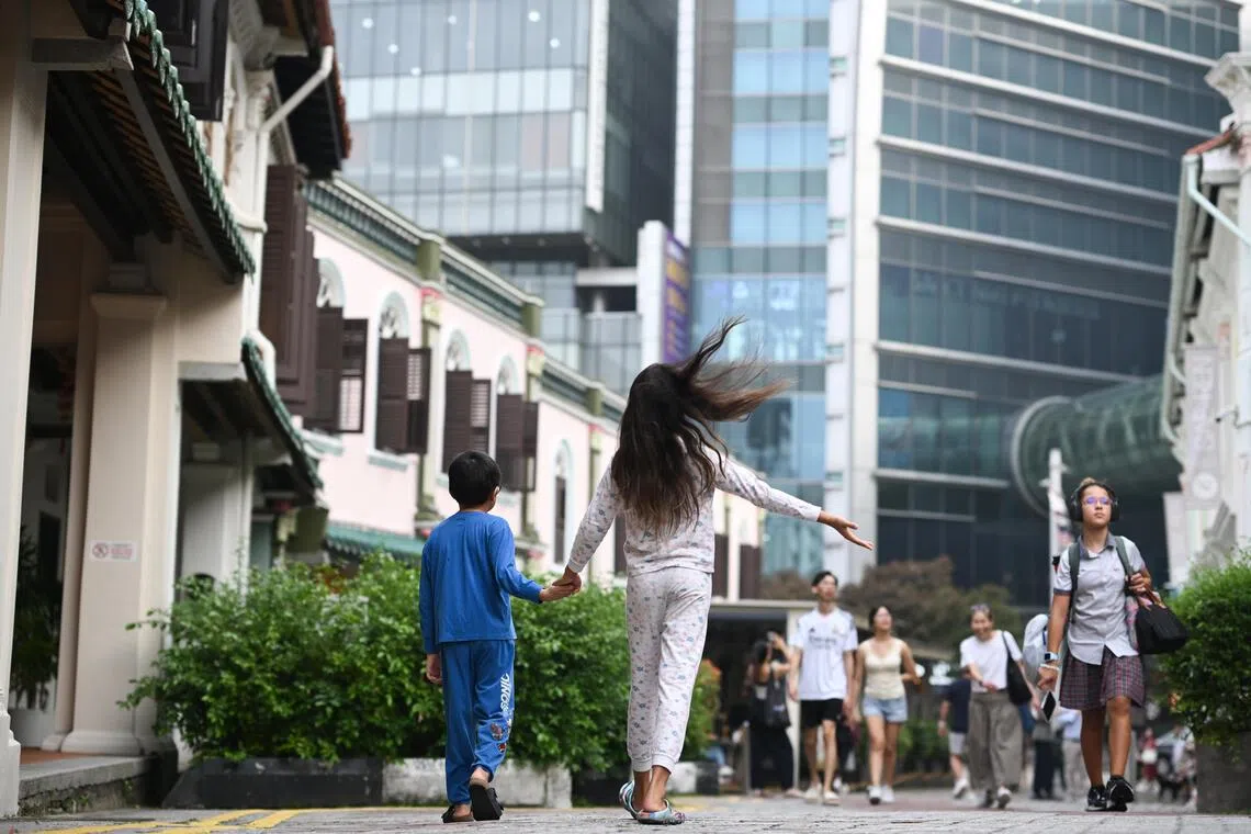 The children of Deborah Yeo, secretary of Emerald Hill Conservation Association, routinely walk to Orchard Road in their pyjamas, treating the global shopping street as part of their forever home.