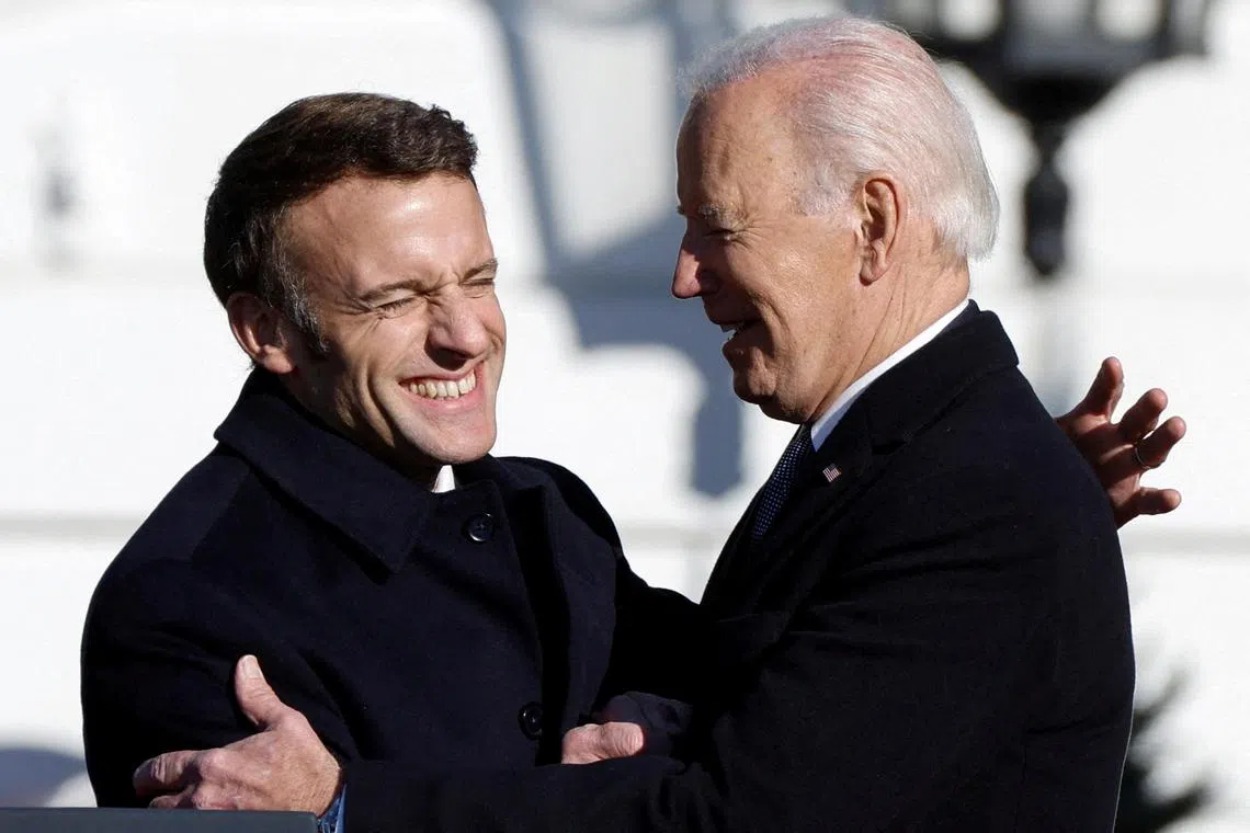 US President Joe Biden (right) and French President Emmanuel Macron said they were committed to holding Russia to account for its deeds in Ukraine. 