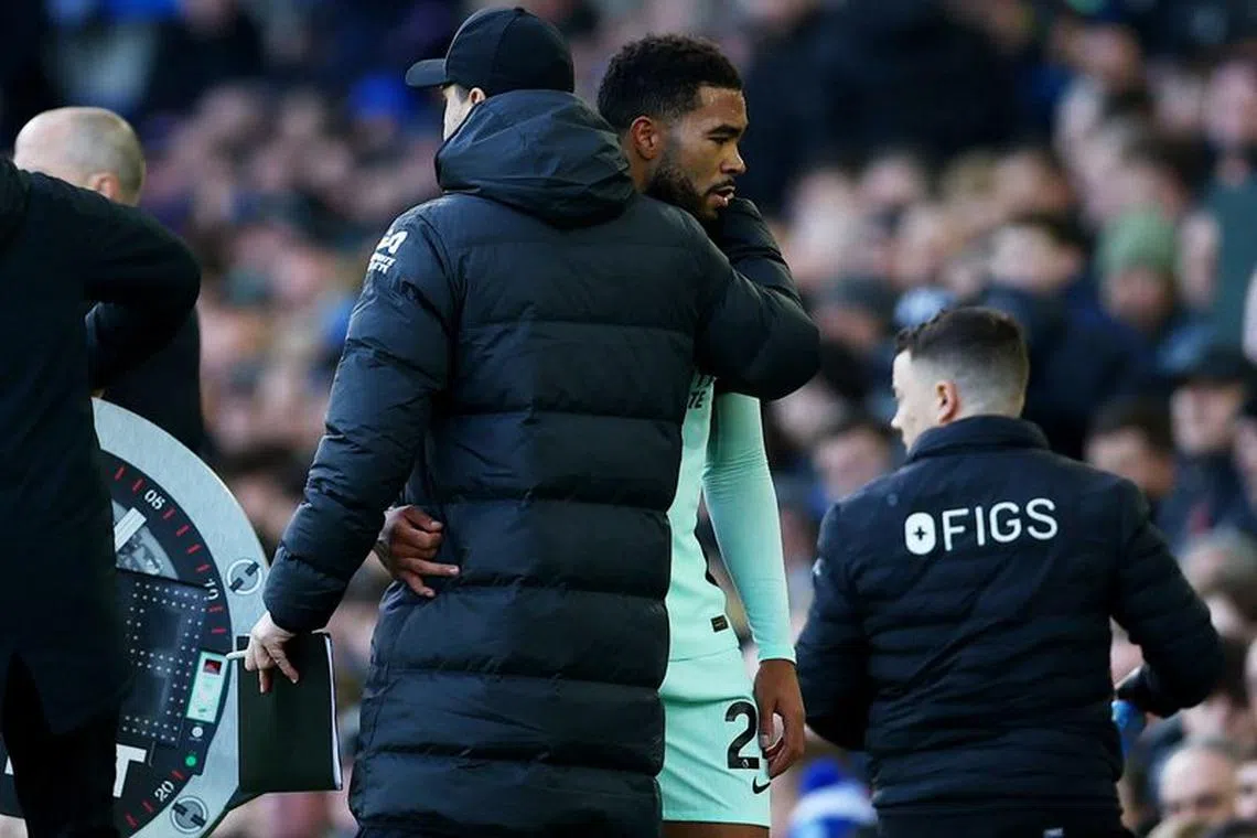 Soccer Football - Premier League - Everton v Chelsea - Goodison Park, Liverpool, Britain - December 10, 2023 Chelsea manager Mauricio Pochettino with Reece James as he is substituted after sustaining an injury REUTERS/Molly Darlington/File Photo