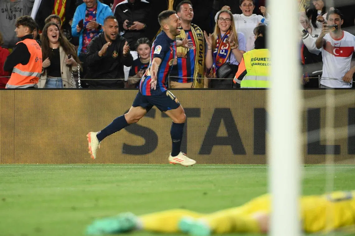 Barcelona defender Jordi Alba celebrating after scoring a goal during their 1-0 win against Osasuna at the Camp Nou stadium in Barcelona.