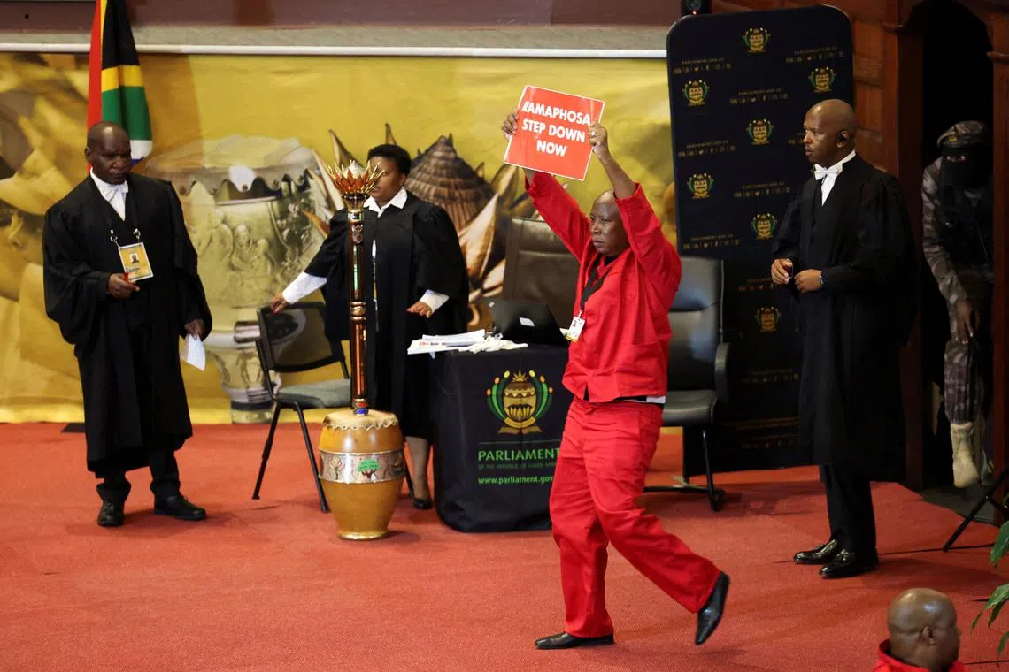 Opposition Economic Freedom Fighters party leader Julius Malema protest on stage as South African President Cyril Ramaphosa attempts to deliver his 2023 state-of-the-nation address (SONA) at the Cape Town City Hall in Cape Town on Feb 9, 2023. 