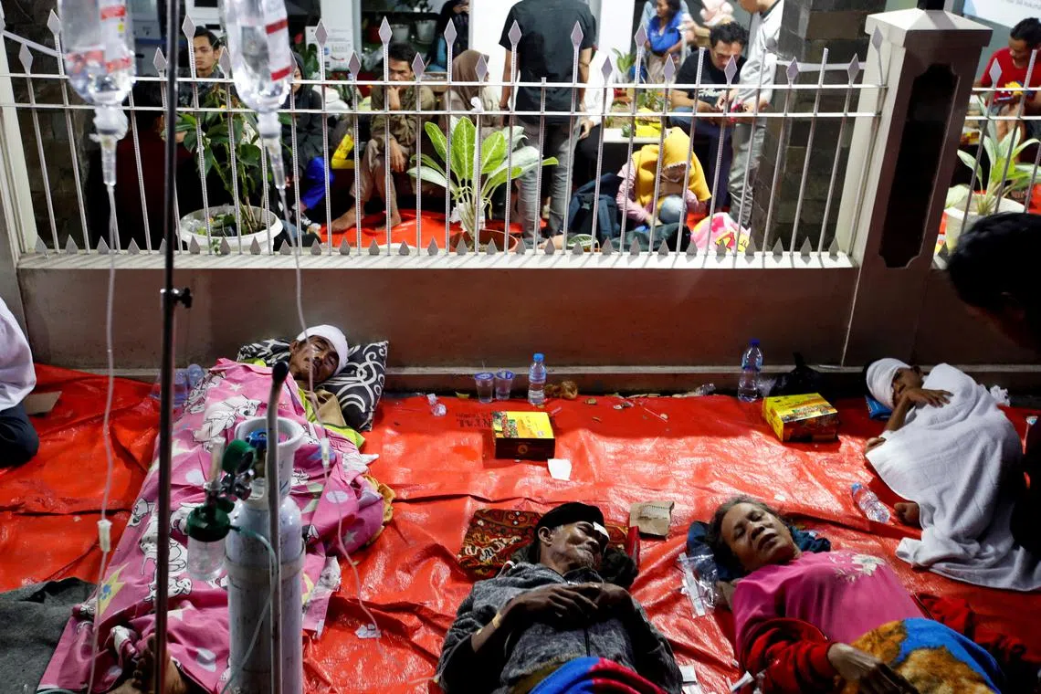 People injured in an earthquake receive treatment at a hospital in Cianjur, West Java province, Indonesia, Nov 21, 2022. 