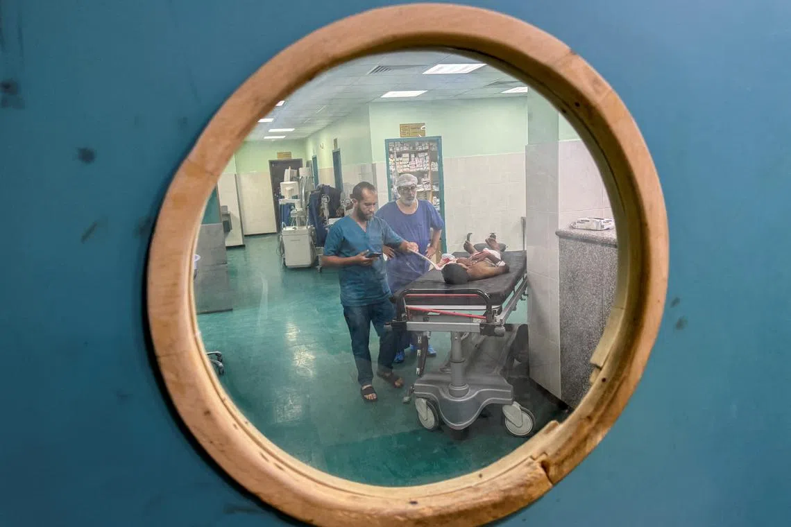 Palestinian boy Ahmed Abu Athab, who was wounded in an Israeli strike, receives treatment at Nasser hospital in Khan Younis, in the southern Gaza Strip, May 28, 2024. REUTERS/Mohammed Salem