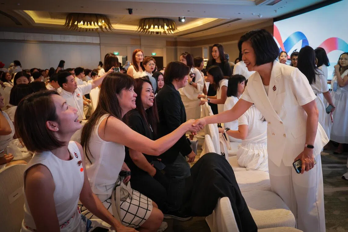 PAP Women’s Wing Chairperson Sim Ann interacting with the attendees during the PAP Women?s Wing Conference 2026 at Mandarin Oriental Singapore.