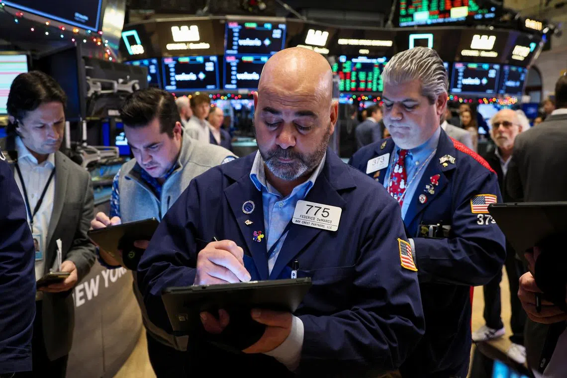 Traders work on the floor of the New York Stock Exchange, on Dec 7, 2022.